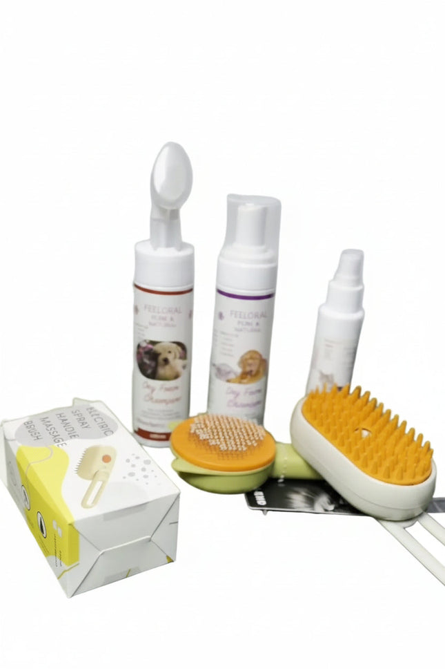 Set of pet grooming products including bottles, a brush, and a box on a white background