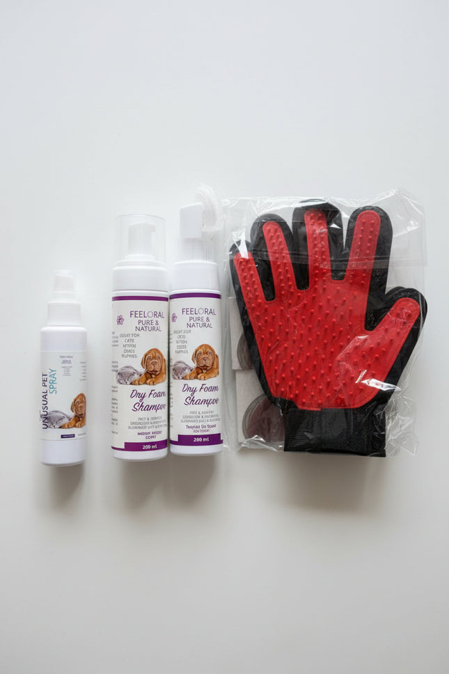 Pet care products including bottles and a glove on a surface.